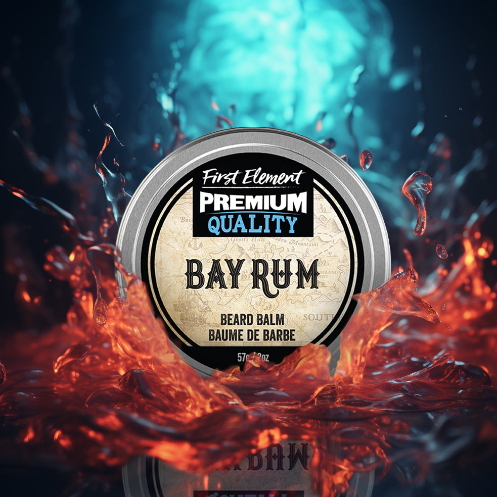 Image of a 2oz metal tin of Premium Bay Rum scented Beard Balm from First Element, handcrafted in Canada. The tin has a screw-on top with a tamper-evident seal, set against a colorful splash background, showcasing its premium quality and all-natural, hand-poured formula.