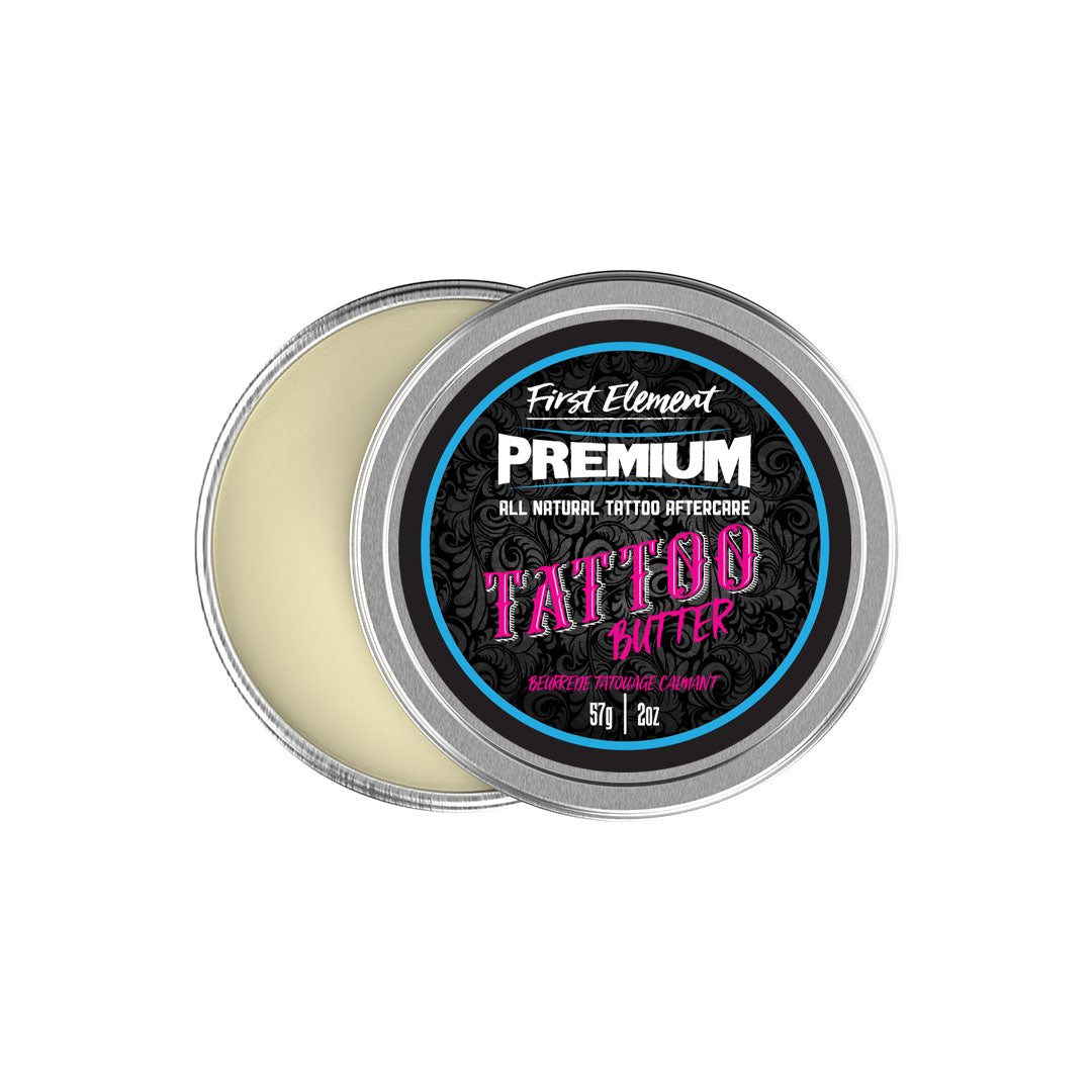 A 2 oz metal screw top tin of Tattoo Butter against a clean white background