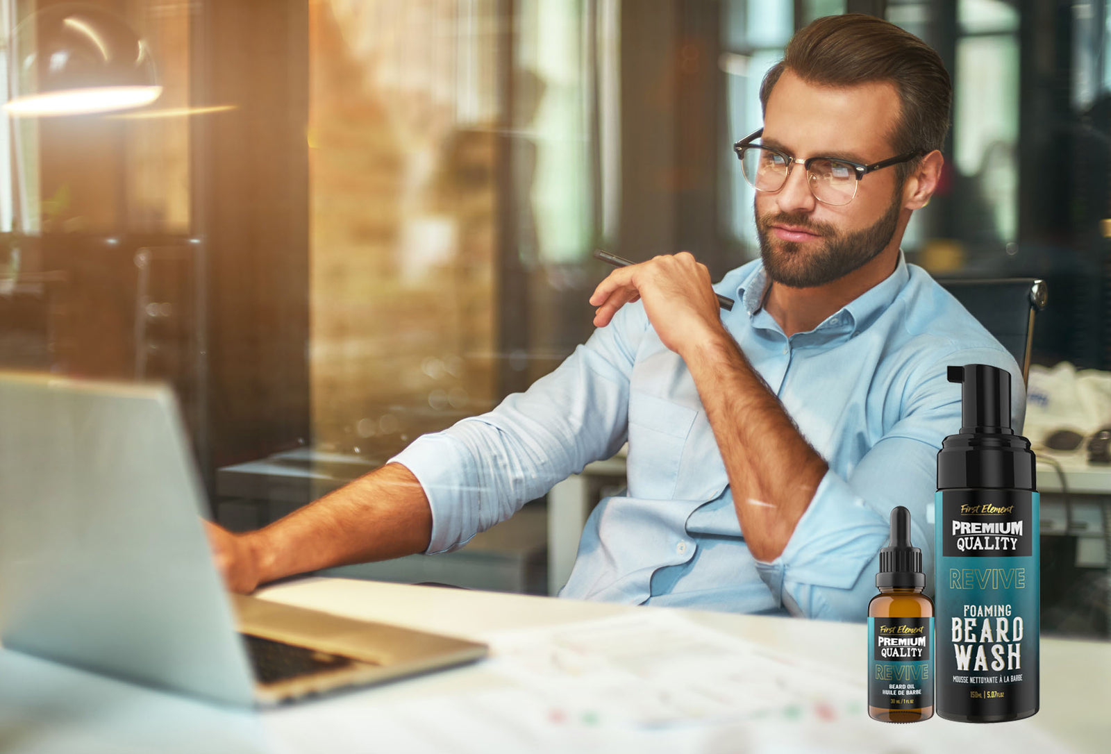 Beard Care Website development. Guy sitting behind a laptop with beard oil and beard wash on the table