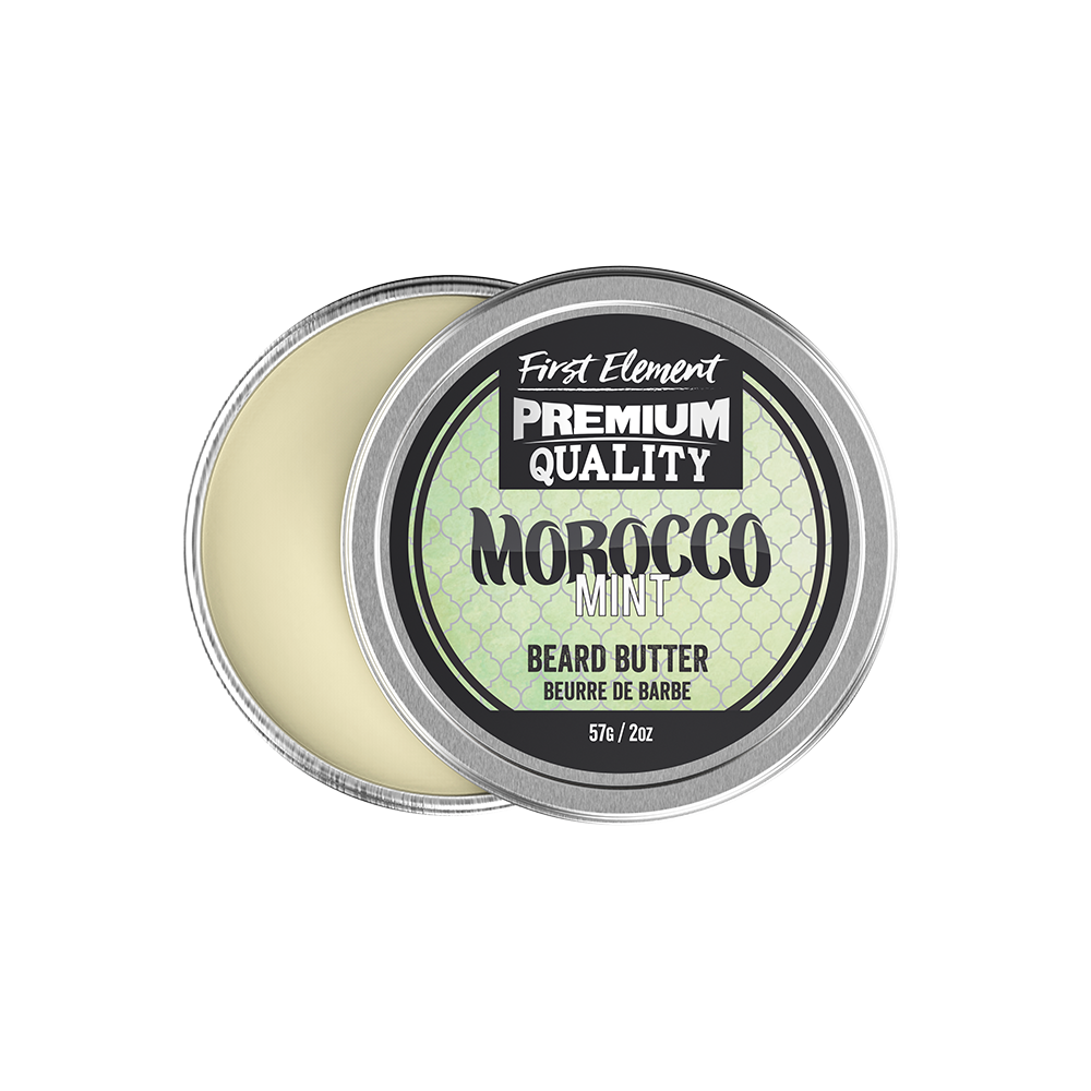 Image of a sleek 2oz metal tin of Morocco Mint scented Beard Butter with a screw-on top and tamper-evident seal, hand-poured in small batches in Canada. The tin sits against a backdrop of greenery, reflecting the natural ingredients used in the product.