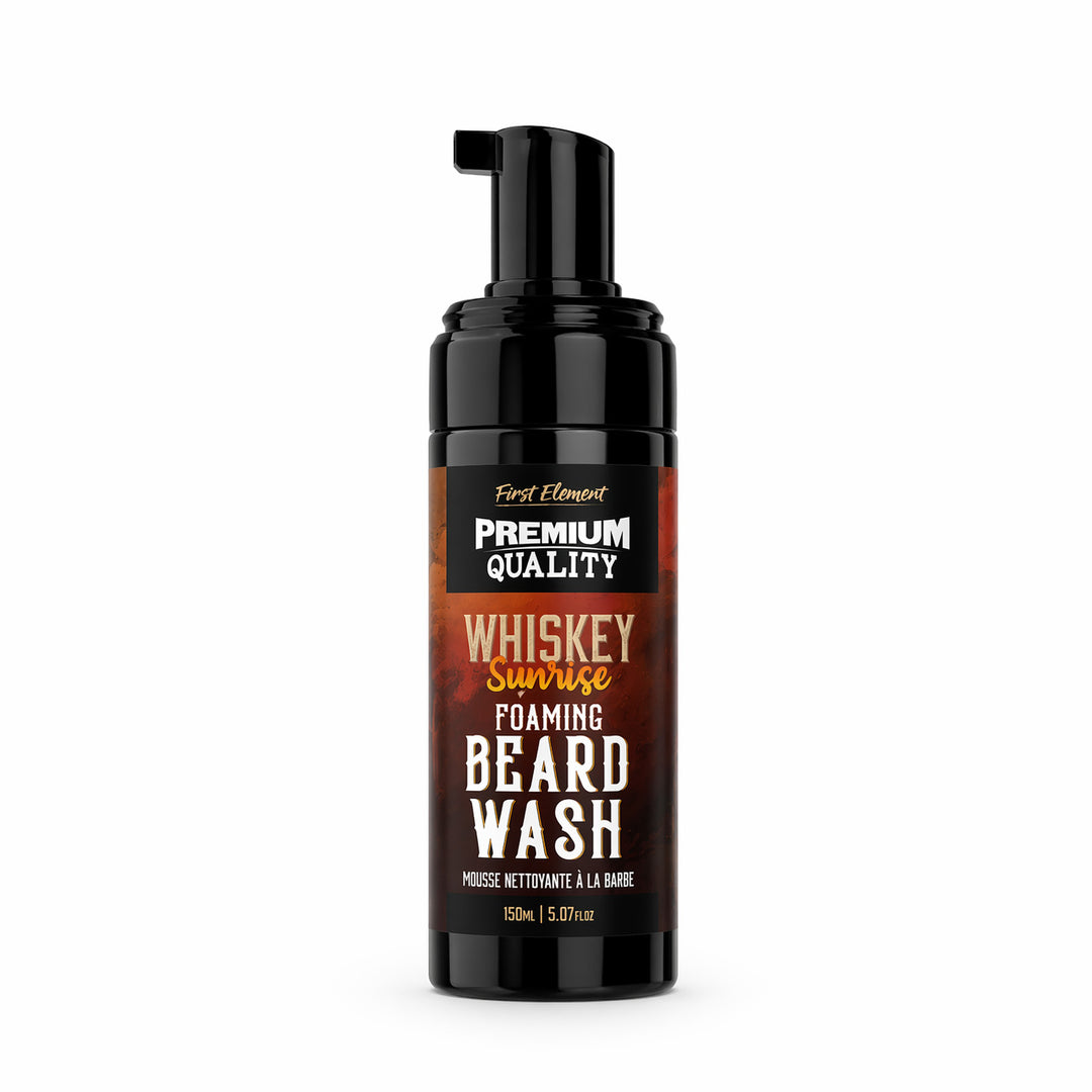 Foaming beard wash bottle labeled 'Whiskey Sunrise' on a white background