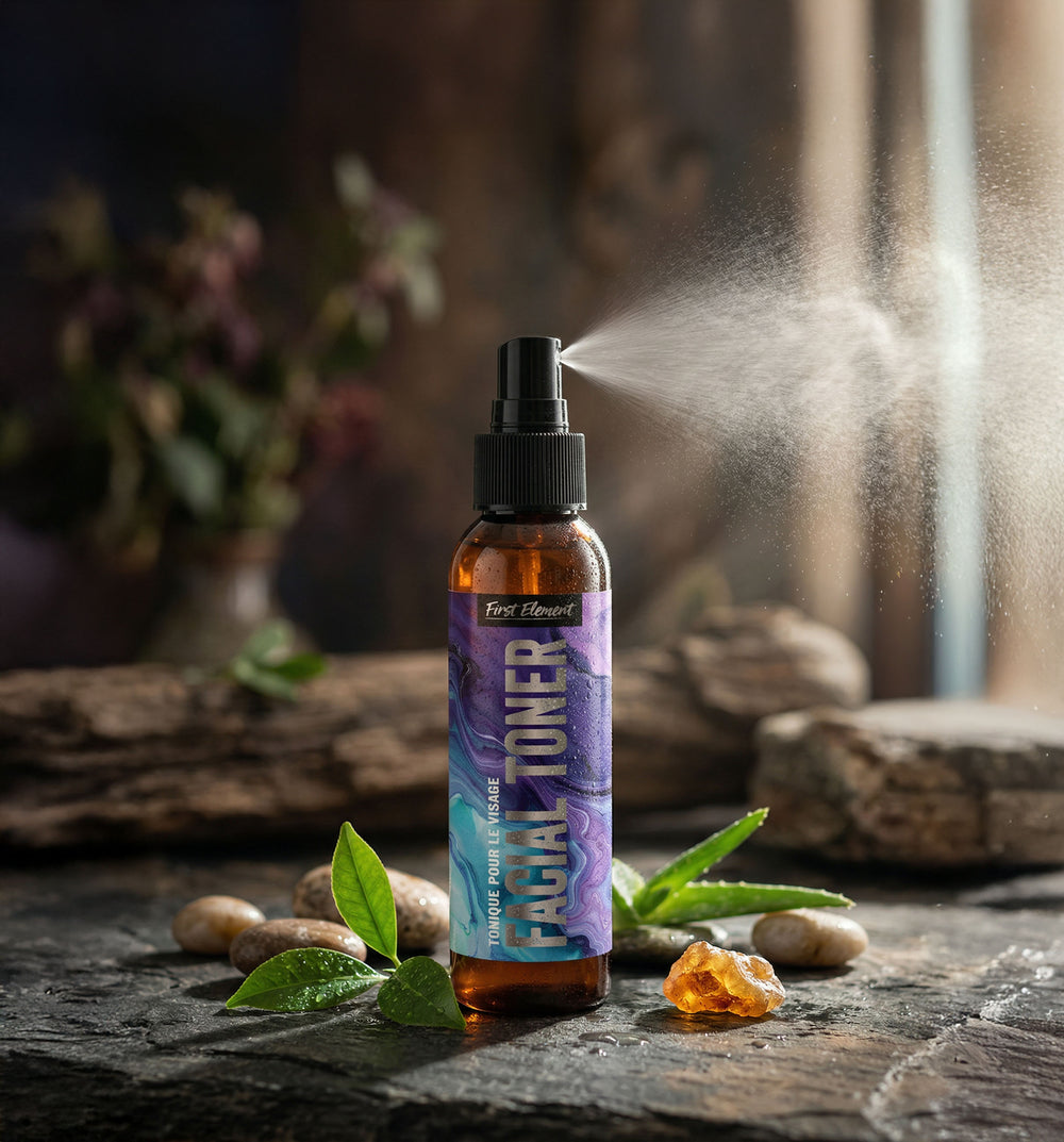 First Element Facial Toner showing the fine mist sprayer as it sprays into the air. 