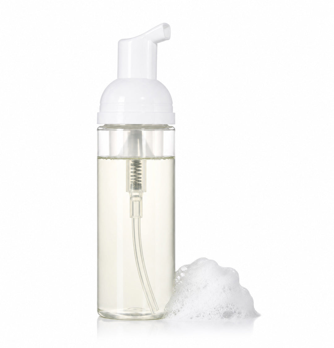Foam soap dispenser with white pump and clear body on a white background
