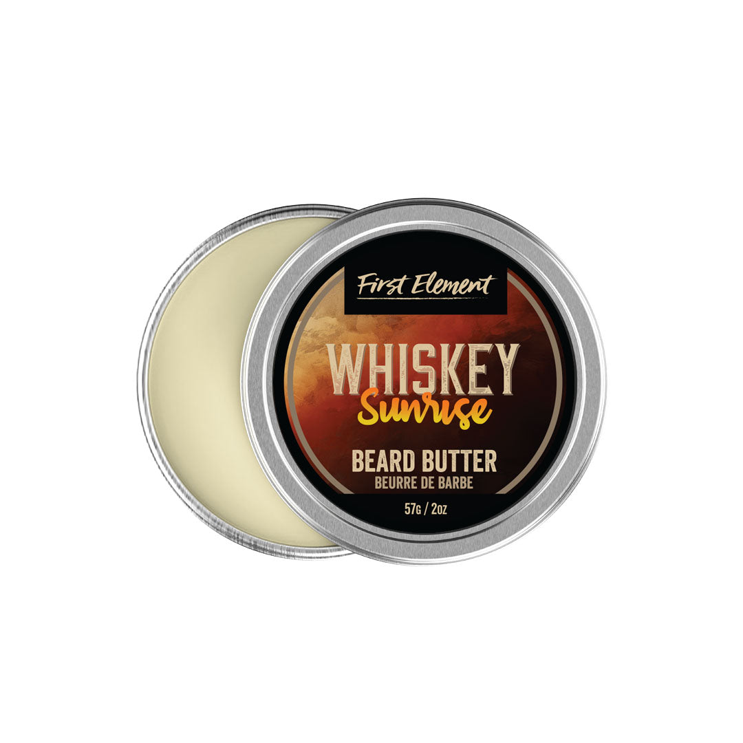 Beard butter container labeled 'Whiskey Sunrise' by 'First Element' on a white background