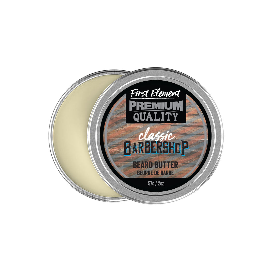 Image: A 2-ounce metal tin with a screw-on top and tamper-evident seal containing Beard Butter. The label indicates the product is made in Canada and highlights its premium quality and moisturizing properties for both beard and skin. The tin features a classic barbershop scent and promises to reduce beard itch and promote softness.