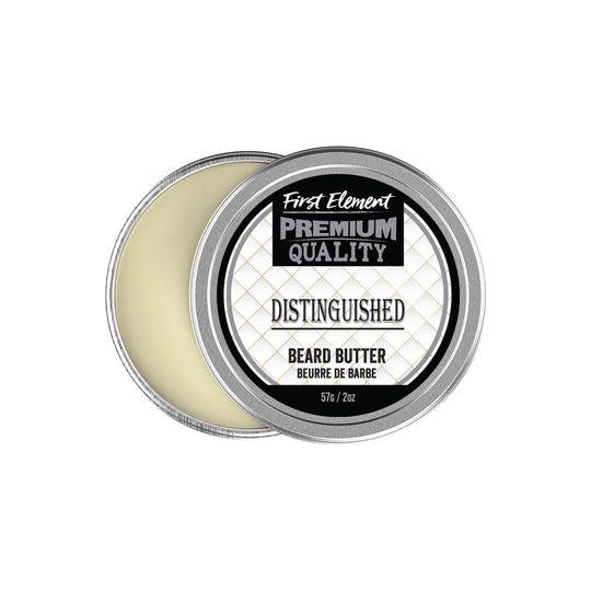 A small metal tin of Distinguished Beard Butter, proudly made in Canada. The tin features a screw-on top with a tamper-evident seal. The label showcases the product name and key features, highlighting its moisturizing properties for both hair and skin. The background suggests a luxurious grooming experience.